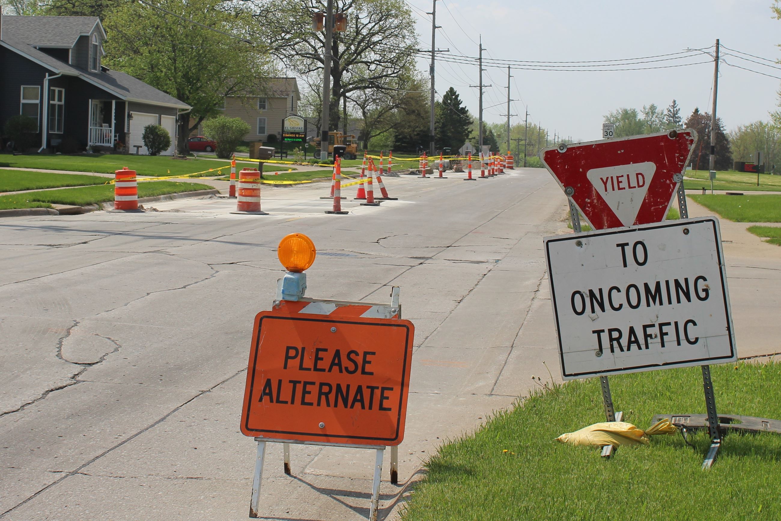 Full Depth Patch project work on Houser Street with traffic control signs (JPG)