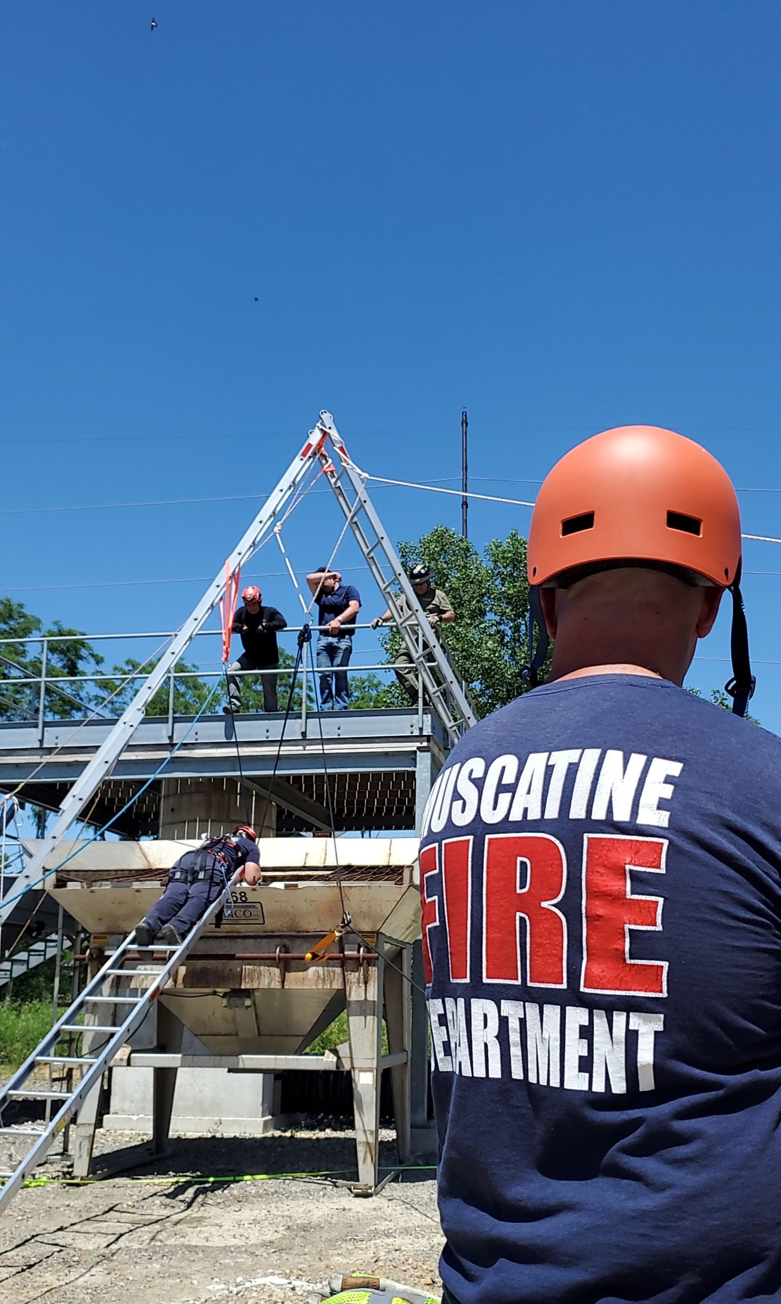 Muscatine Firefighters using ladders as anchor June 2022 (JPG)