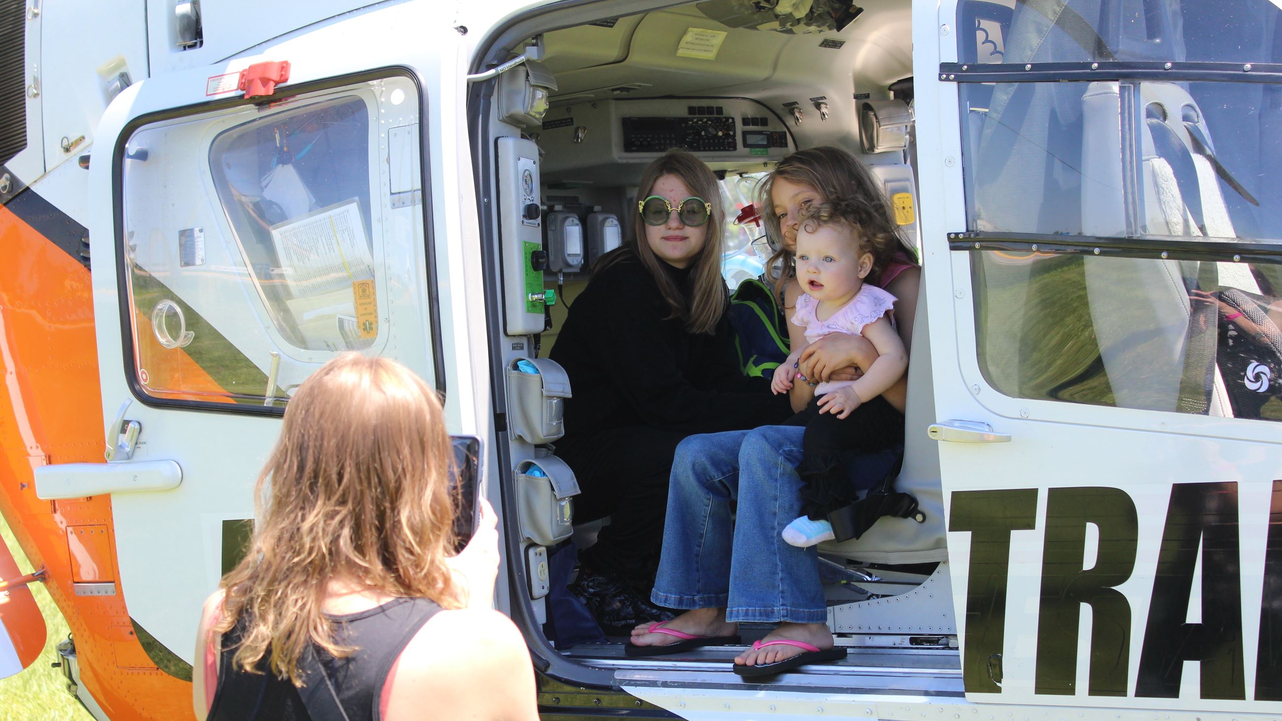 052524 EMS 2024 Child Day (JPG) family sitting inside MedForce 1