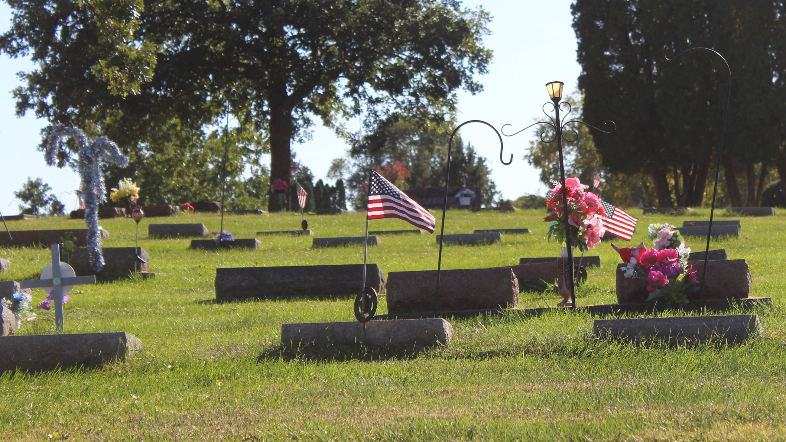 100322 Greenwood Cemetery fall clean-up completed (JPG) showing decor on gravesites