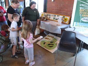 Young kids looking at display